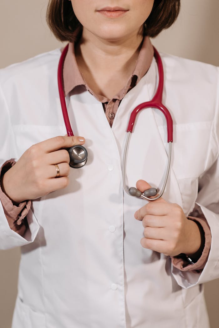 services-01 Portrait of a female doctor holding a stethoscope, symbolizing healthcare and professionalism.